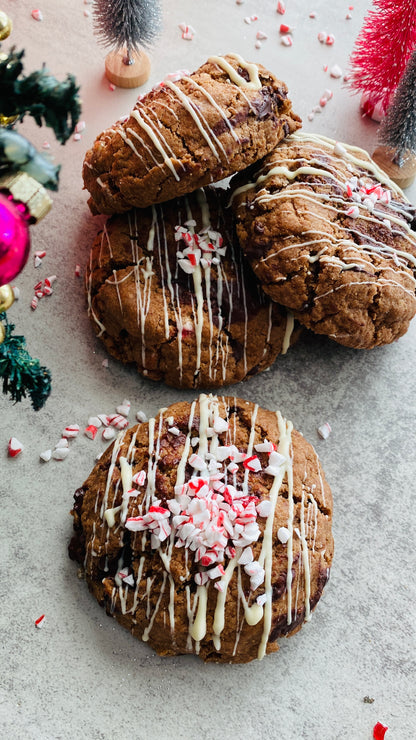 Cookies with white drizzle and candy on a festive background