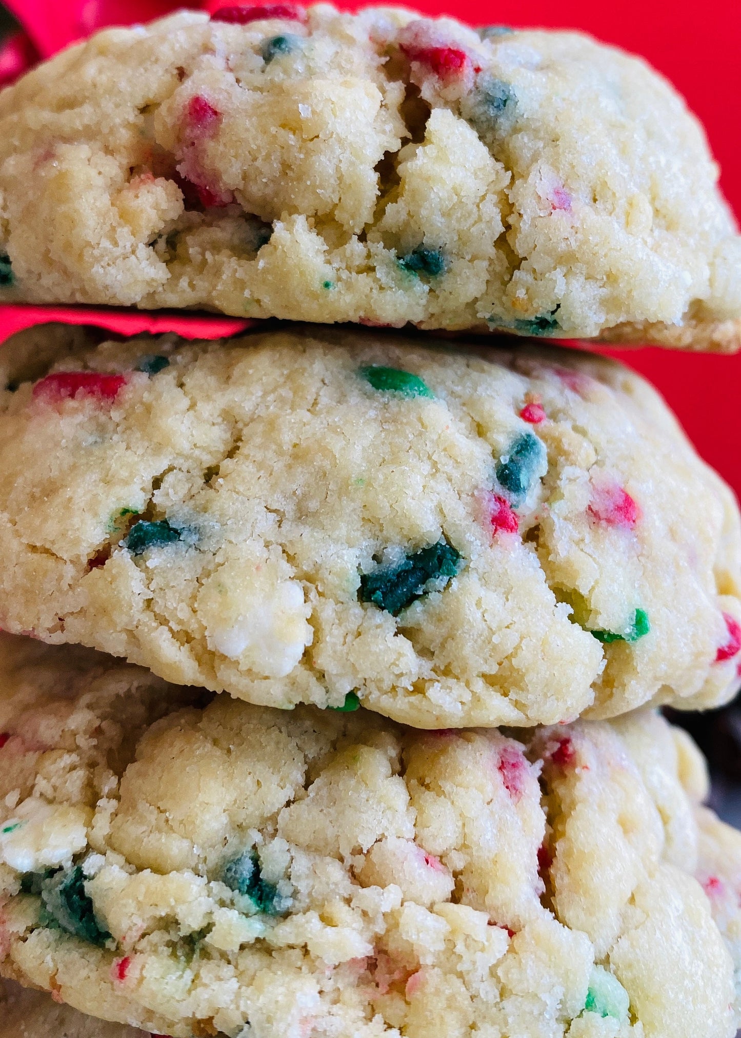 Stack of colorful cookies on a red background