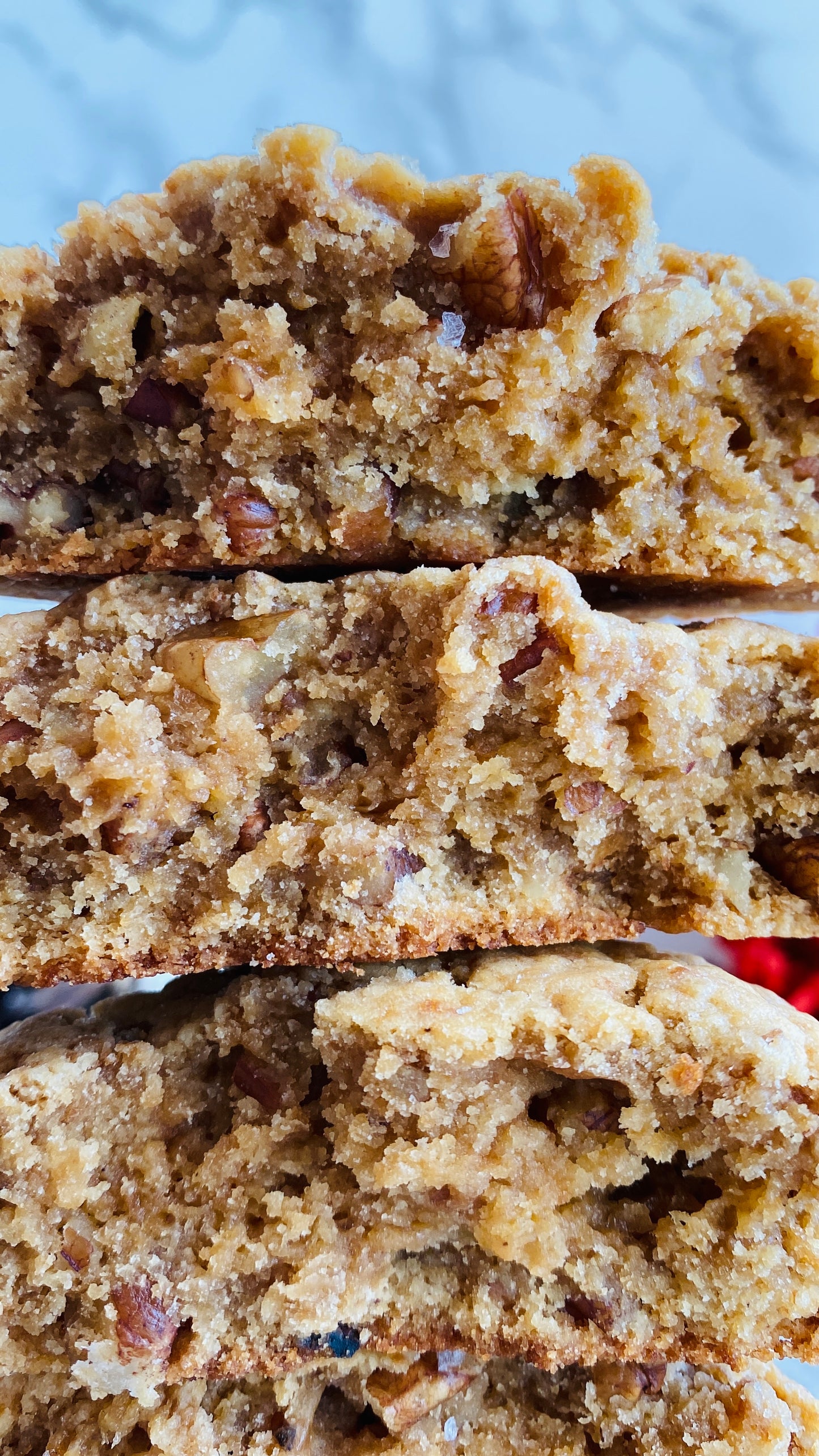 Close-up of a stack of pecan cookies with a blurred background